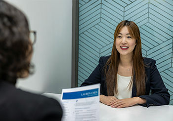 executive recruiter woman interviewing a C-level candidate.