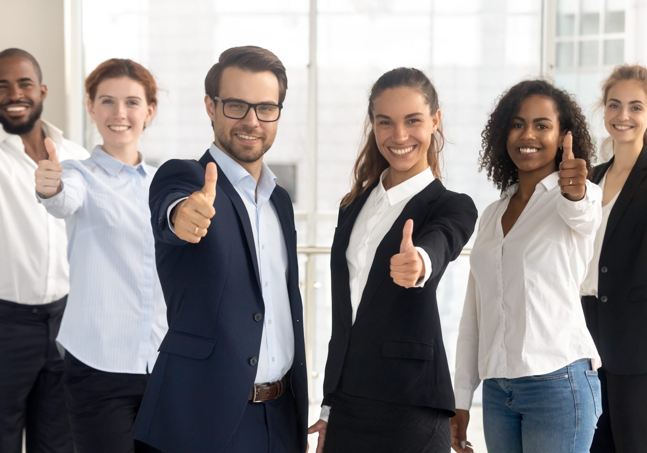 Business,Leaders,With,Employees,Group,Showing,Thumbs,Up,Looking,At